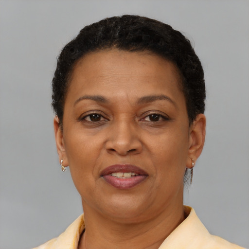 Joyful latino adult female with short  brown hair and brown eyes