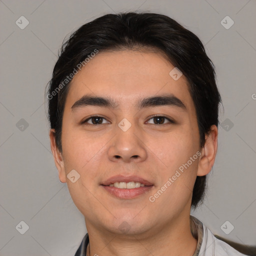 Joyful white young-adult male with short  black hair and brown eyes