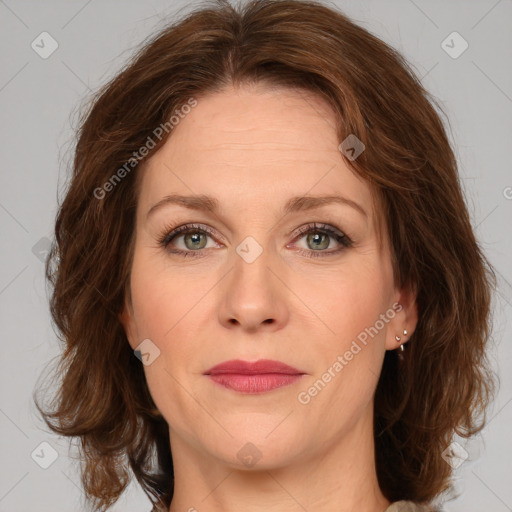 Joyful white young-adult female with medium  brown hair and green eyes