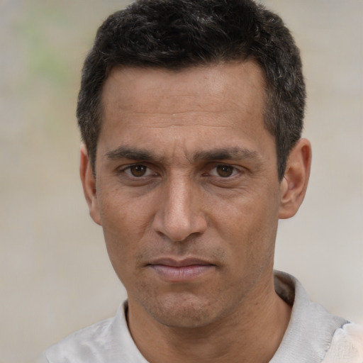 Neutral white adult male with short  black hair and brown eyes