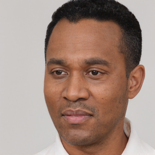 Neutral black adult male with short  black hair and brown eyes