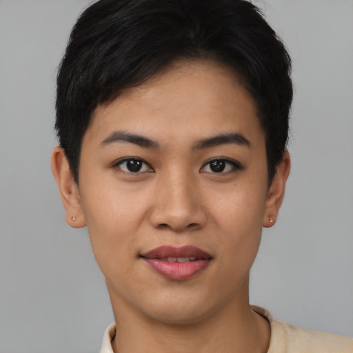 Joyful asian young-adult female with short  black hair and brown eyes