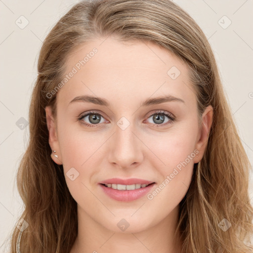 Joyful white young-adult female with long  brown hair and blue eyes