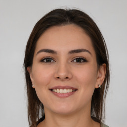 Joyful white young-adult female with medium  brown hair and brown eyes