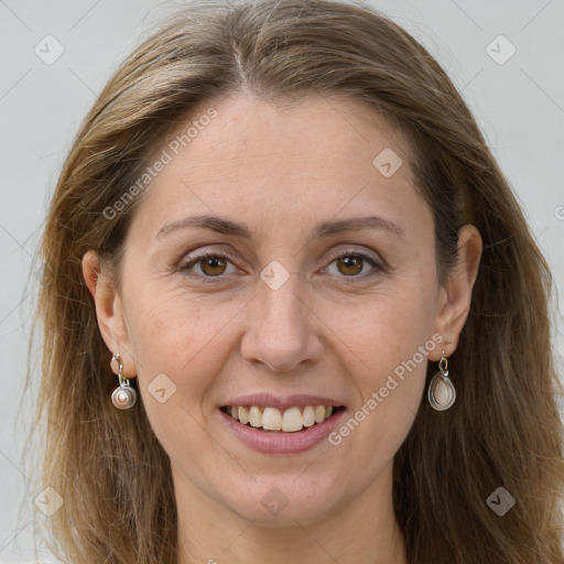 Joyful white adult female with long  brown hair and grey eyes