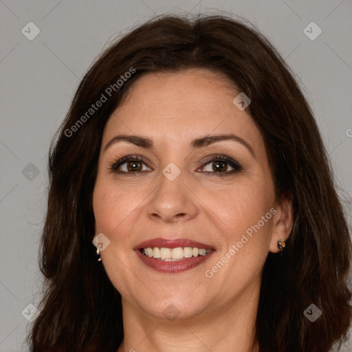 Joyful white adult female with long  brown hair and brown eyes