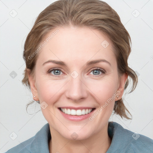 Joyful white young-adult female with medium  brown hair and blue eyes