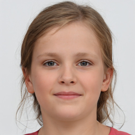 Joyful white child female with medium  brown hair and grey eyes