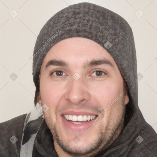 Joyful white young-adult male with short  black hair and brown eyes