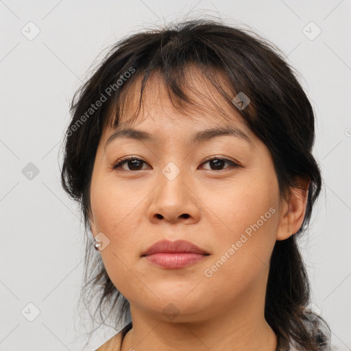 Joyful asian young-adult female with medium  brown hair and brown eyes