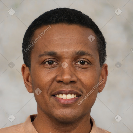 Joyful black young-adult male with short  black hair and brown eyes