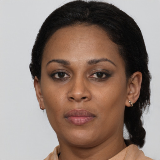 Neutral black adult female with short  black hair and brown eyes