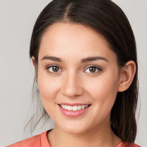 Joyful white young-adult female with medium  brown hair and brown eyes