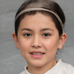 Joyful white child female with short  brown hair and brown eyes