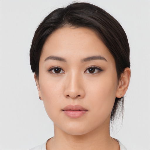 Neutral asian young-adult female with medium  black hair and brown eyes