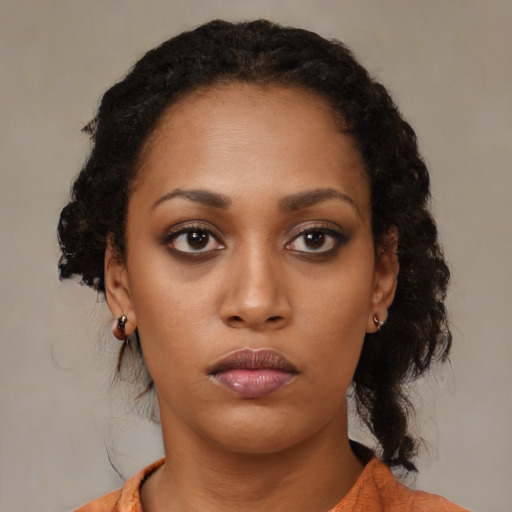 Neutral black young-adult female with medium  black hair and brown eyes