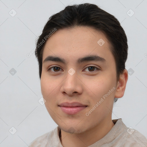 Joyful asian young-adult male with short  brown hair and brown eyes