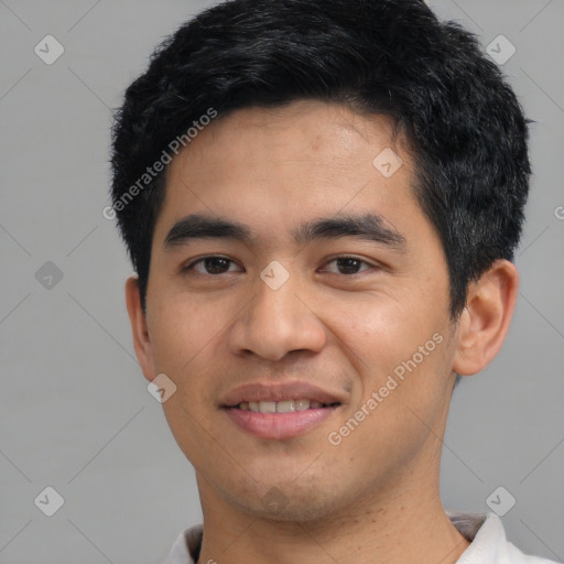 Joyful asian young-adult male with short  black hair and brown eyes