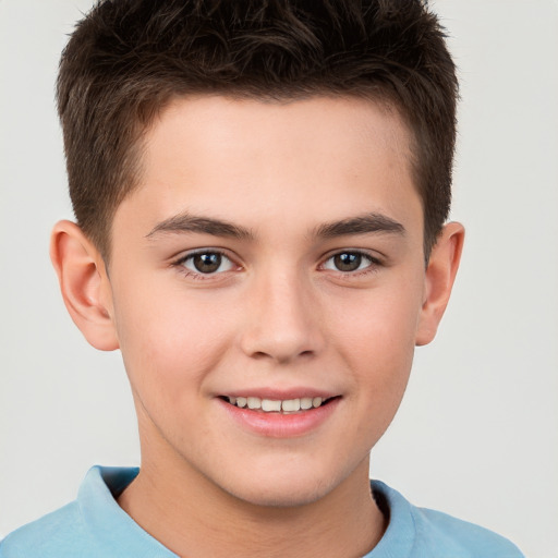 Joyful white child male with short  brown hair and brown eyes