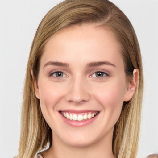 Joyful white young-adult female with long  brown hair and grey eyes