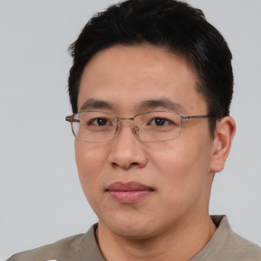 Neutral asian adult male with short  black hair and brown eyes