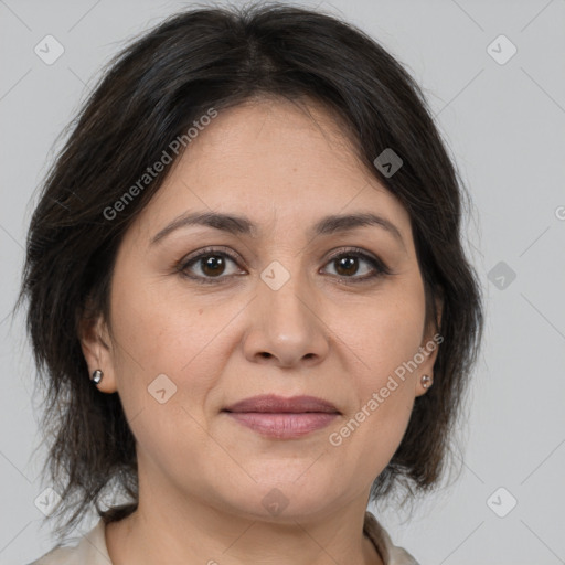 Joyful white adult female with medium  brown hair and brown eyes