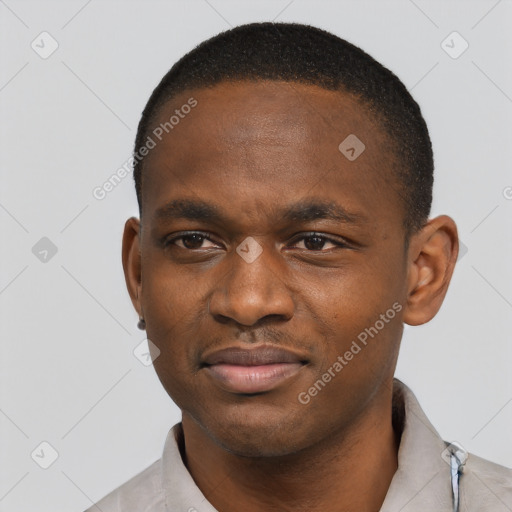 Joyful black young-adult male with short  black hair and brown eyes