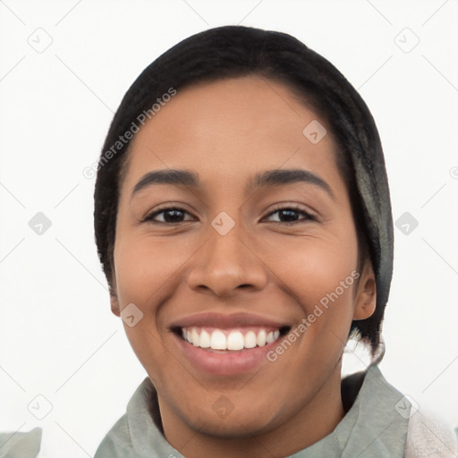 Joyful latino young-adult female with short  black hair and brown eyes