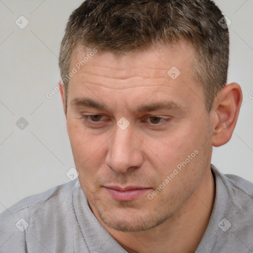 Joyful white adult male with short  brown hair and brown eyes