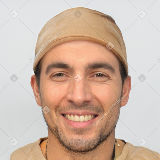 Joyful white young-adult male with short  black hair and brown eyes