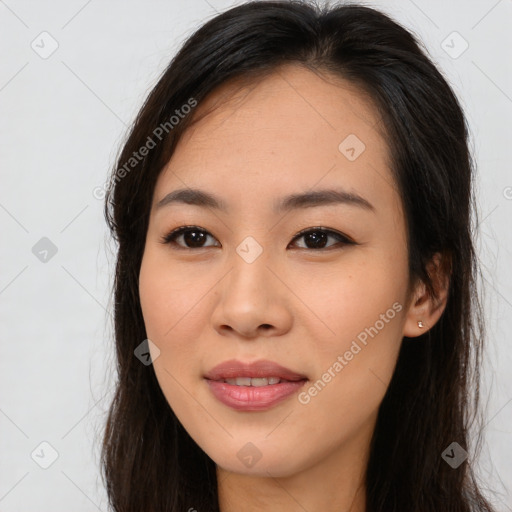 Joyful asian young-adult female with long  brown hair and brown eyes