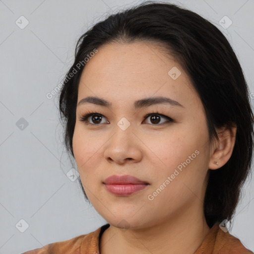 Joyful white young-adult female with medium  black hair and brown eyes