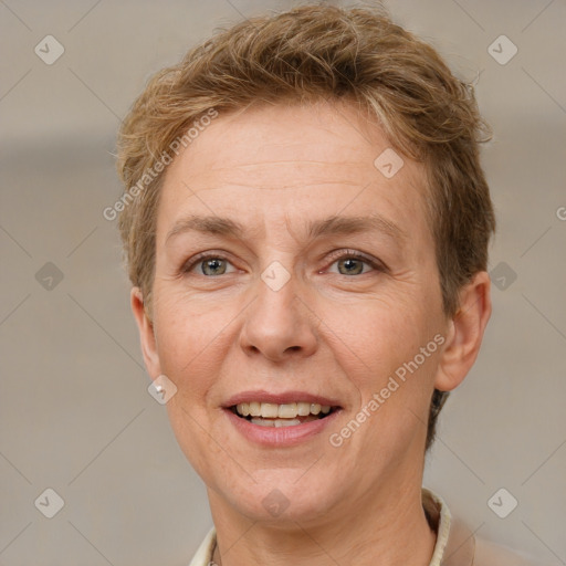 Joyful white adult female with short  brown hair and grey eyes