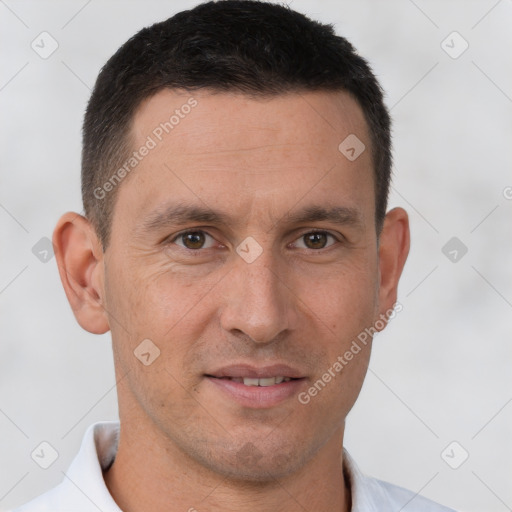 Joyful white adult male with short  brown hair and brown eyes