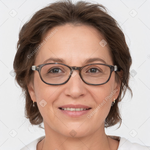 Joyful white adult female with medium  brown hair and grey eyes