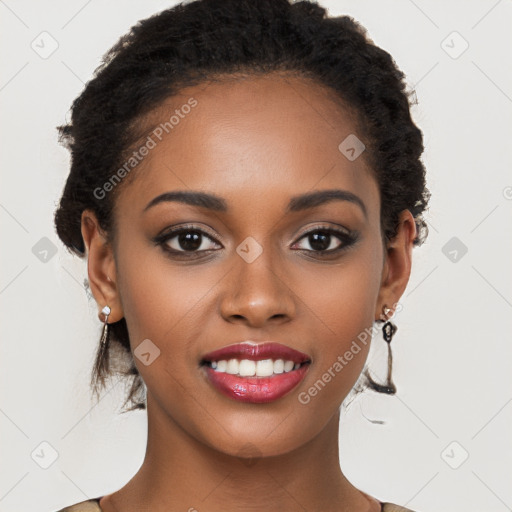 Joyful black young-adult female with long  brown hair and brown eyes