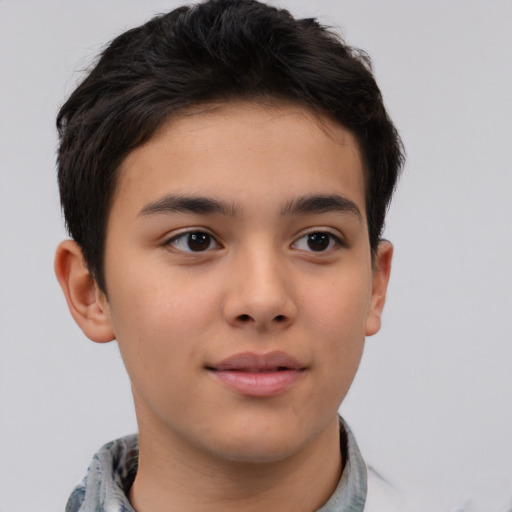 Joyful asian child male with short  brown hair and brown eyes