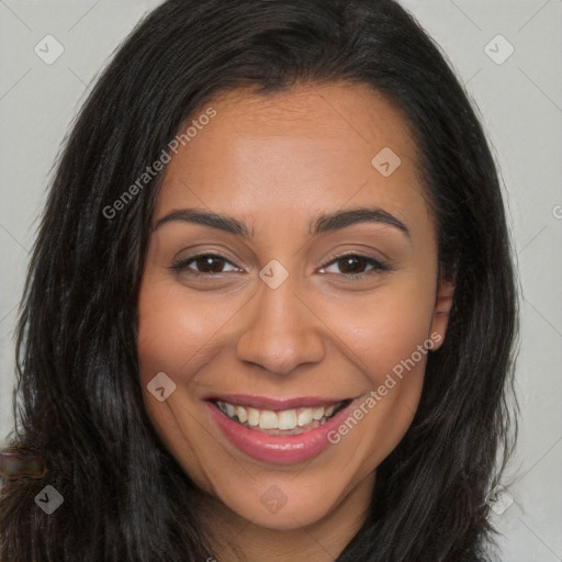 Joyful latino young-adult female with long  brown hair and brown eyes