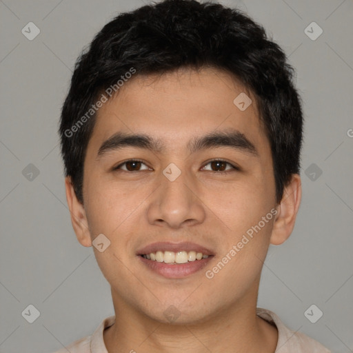 Joyful asian young-adult male with short  black hair and brown eyes