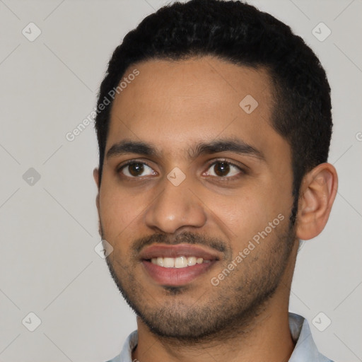 Joyful latino young-adult male with short  black hair and brown eyes