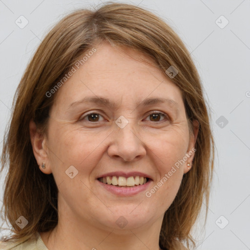 Joyful white adult female with medium  brown hair and brown eyes