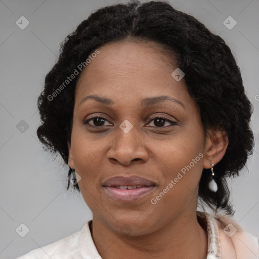 Joyful black adult female with medium  brown hair and brown eyes