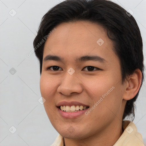 Joyful asian young-adult female with short  brown hair and brown eyes