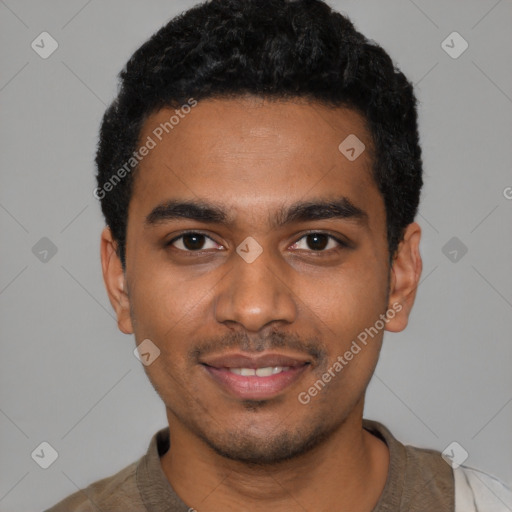 Joyful black young-adult male with short  black hair and brown eyes