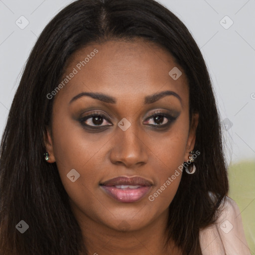 Joyful black young-adult female with long  brown hair and brown eyes