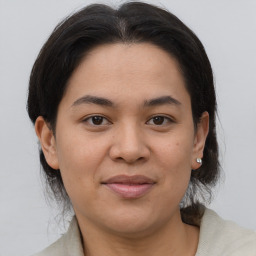 Joyful asian young-adult female with medium  brown hair and brown eyes