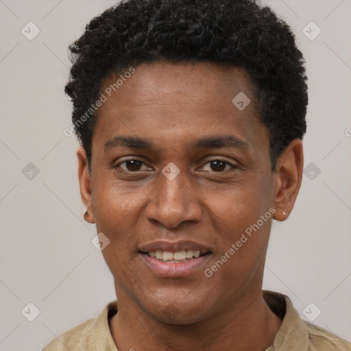 Joyful black young-adult male with short  black hair and brown eyes