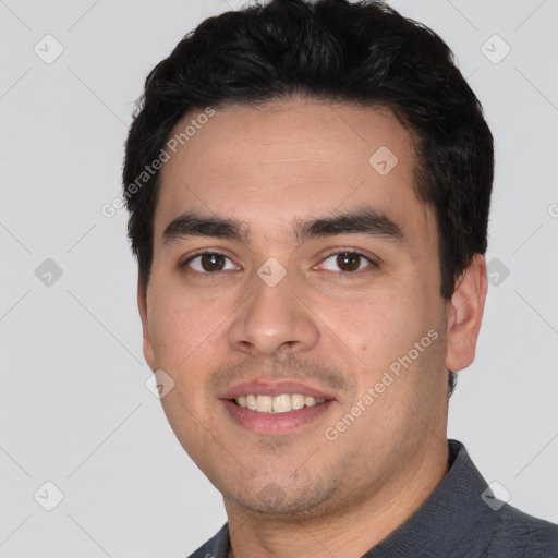 Joyful white young-adult male with short  black hair and brown eyes