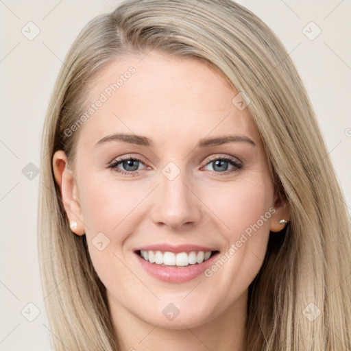 Joyful white young-adult female with long  brown hair and blue eyes