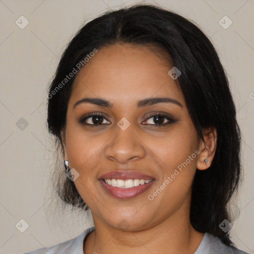 Joyful black young-adult female with medium  black hair and brown eyes